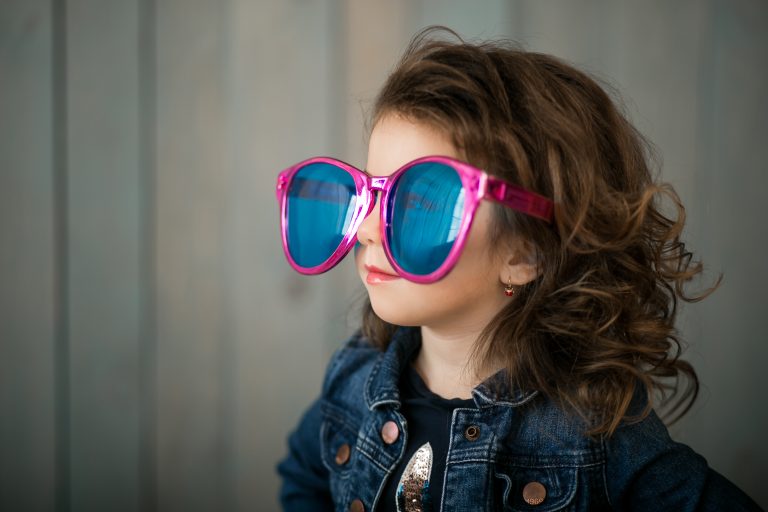 Little girl in big sunglasses
